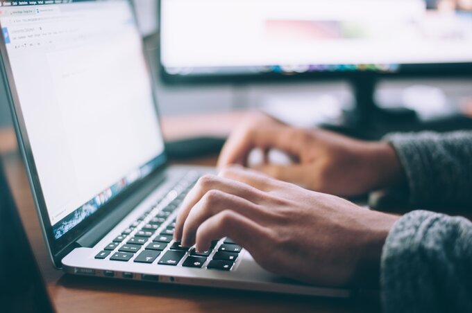 A Man working on a laptop