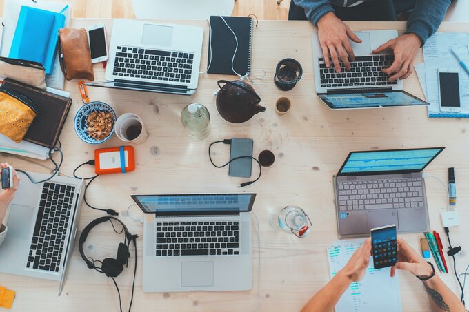 People sitting around a table and working